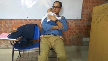 সন্তানকে শিক্ষকের কোলে রেখে পরীক্ষা দিলেন ছাত্রী!